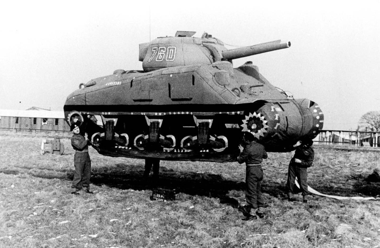 4 soldiers carrying a tank