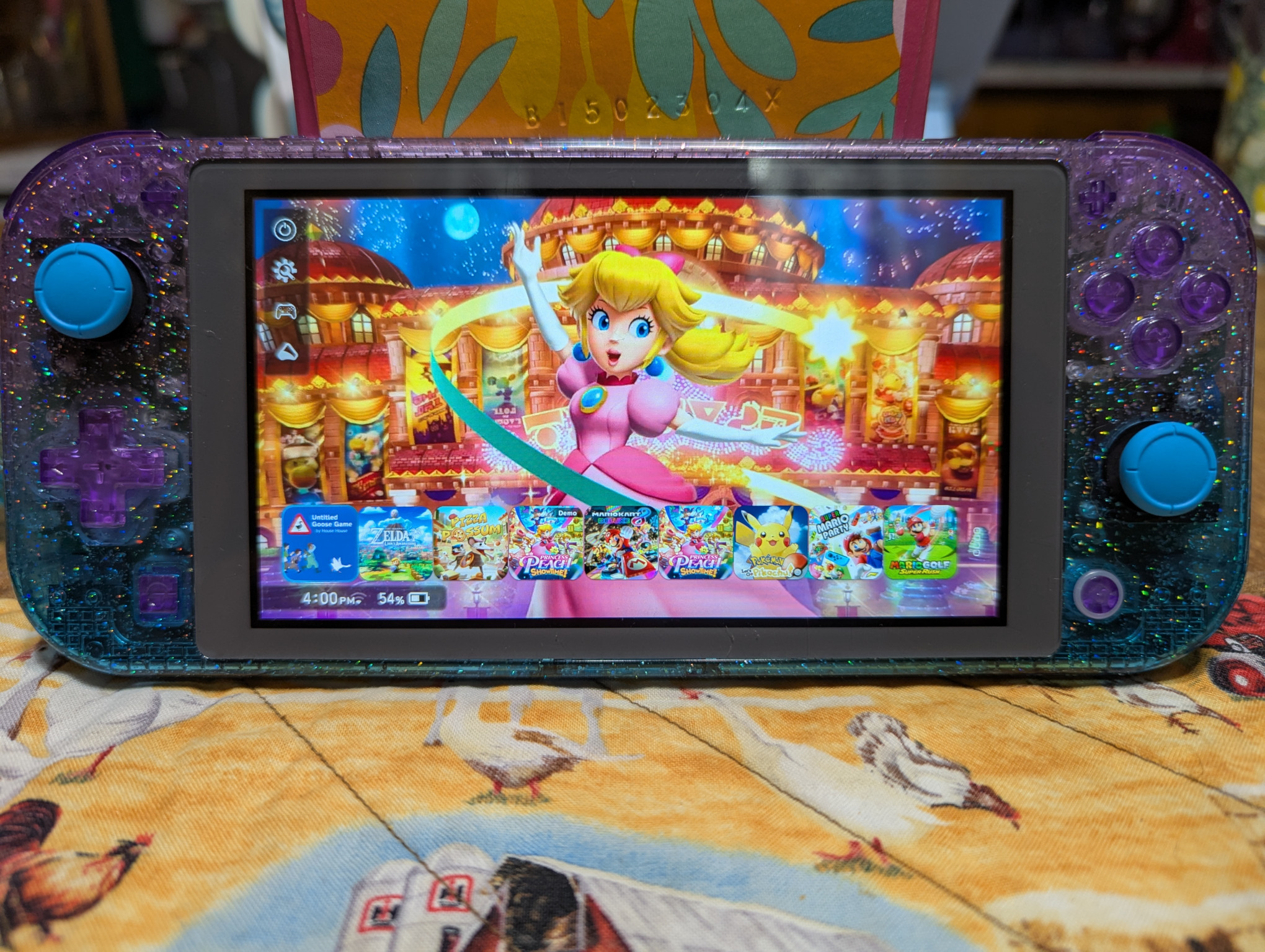 Switch lite with glitter bluebell case and princess peach theme